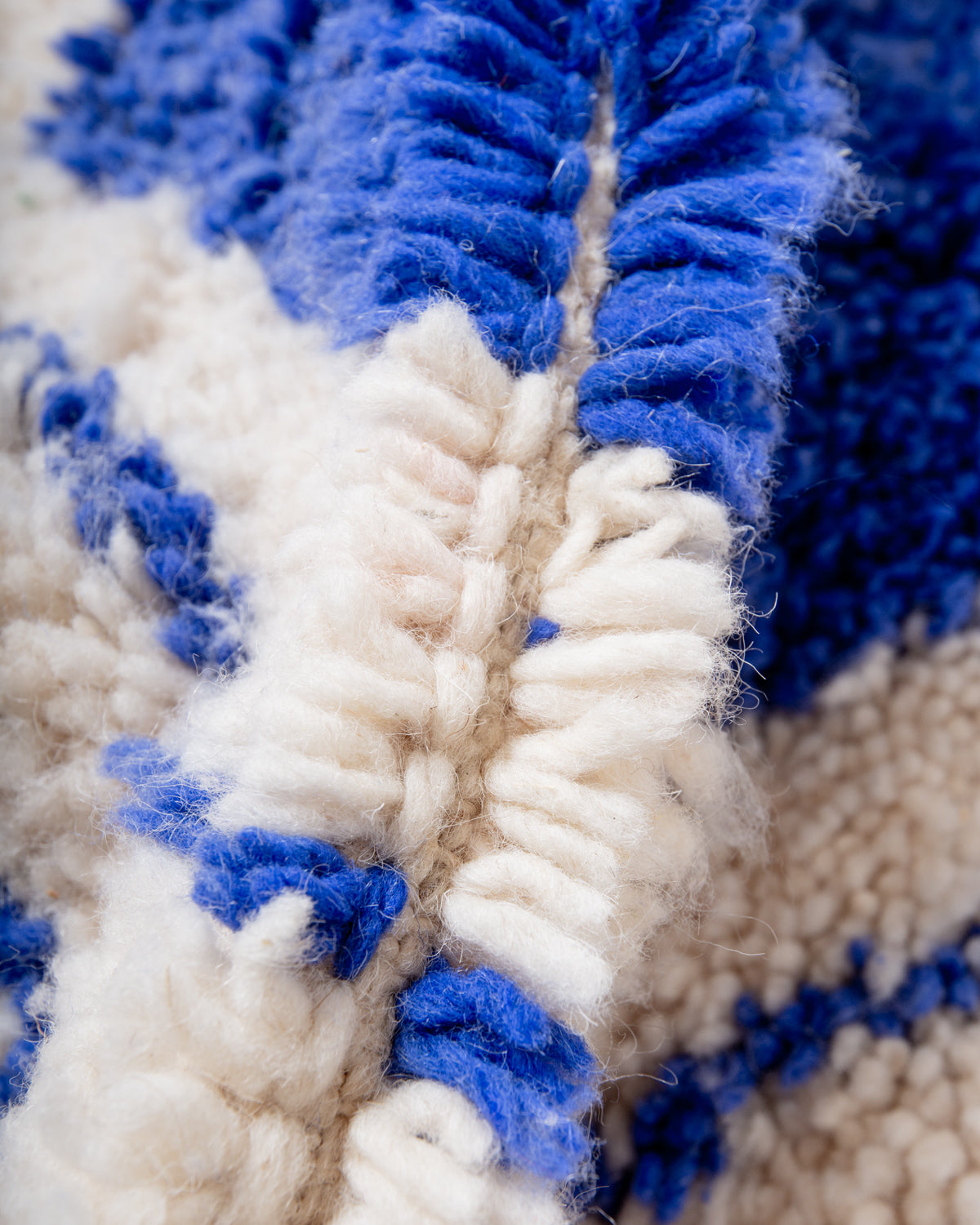 Modern, designer, handcrafted Berber rug from Morocco. Beniourain carpet with beautiful colours and patterns and fluffy wool texture.